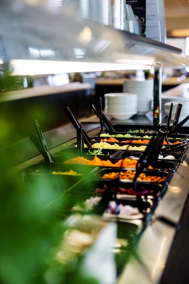Salad bar with fresh produce in the canteen